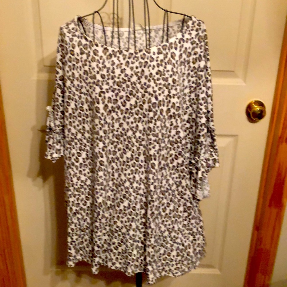 Blue Buttercup Boutique leopard print short sleeve shirt. Size Large/XL.